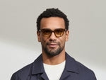 Model is wearing The SHANEKITE SUN in Cognac in size 49 with Chestnut Fade Tinted Lenses