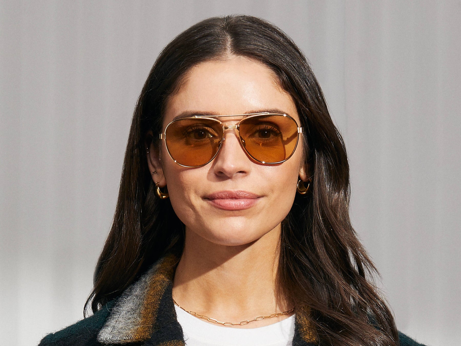 Model is wearing The SHAV SUN in Gold in size 59 with Amber Tinted Lenses