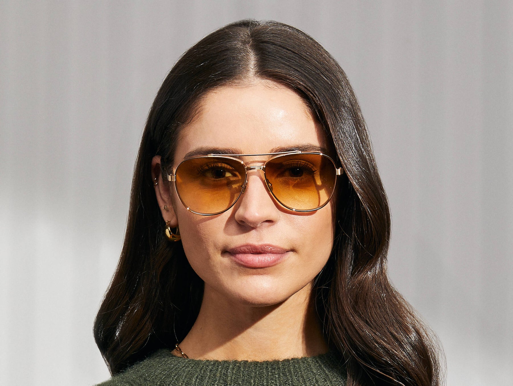 Model is wearing The SHAV SUN in Gold in size 59 with Chestnut Fade Tinted Lenses