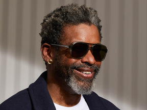 Model is wearing The SHEISTER SUN in Sage in size 57 with Green Lenses