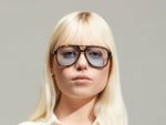 Model is wearing The SHEISTER SUN in Tortoise in size 57 with Bel Air Blue Tinted Lenses