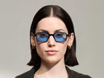 Model is wearing The SHINDIG Black in size 50 with Celebrity Blue Tinted Lenses