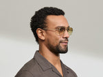 Model is wearing The SHMECKEL SUN in size 53 in Gold with Chestnut Fade Tinted Lenses
