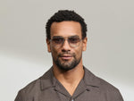 Model is wearing The SHMECKEL SUN in size 53 in Silver with American Grey Fade Tinted Lenses