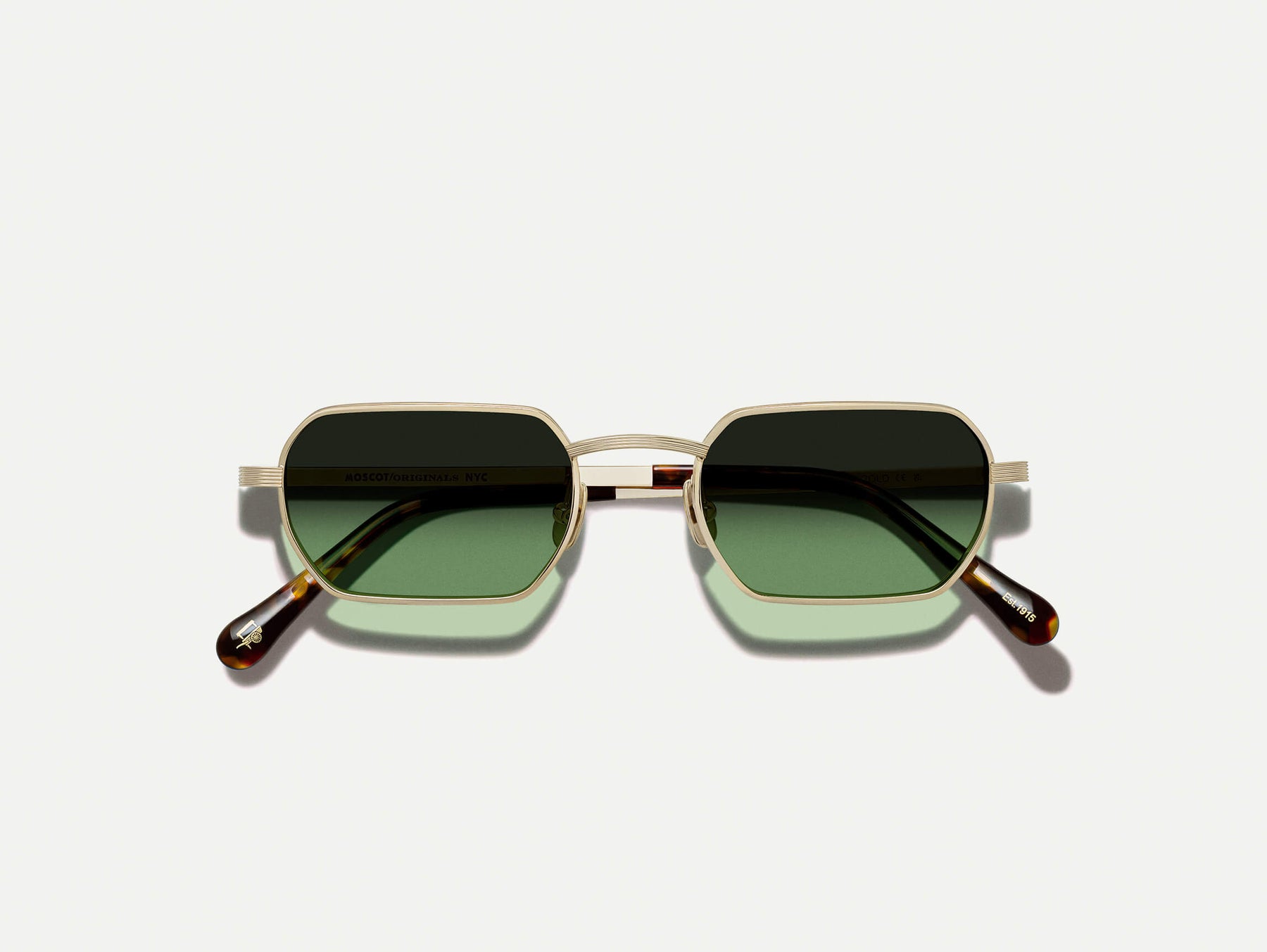 The SHMOOZ SUN in Gold with Forest Wood Tinted Lenses