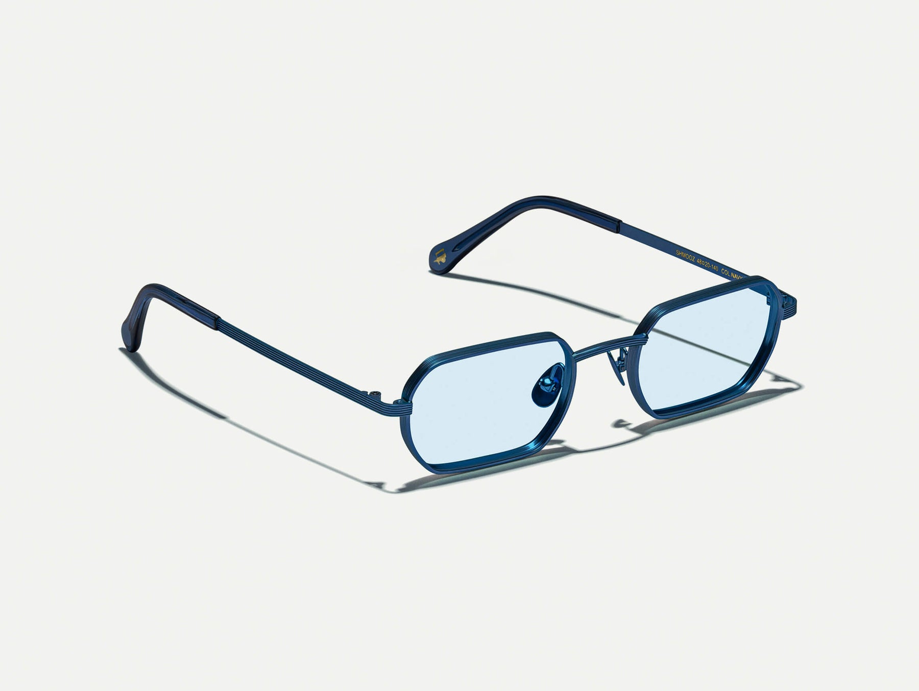 The SHMOOZ SUN in Navy with Bel Air Blue Tinted Lenses