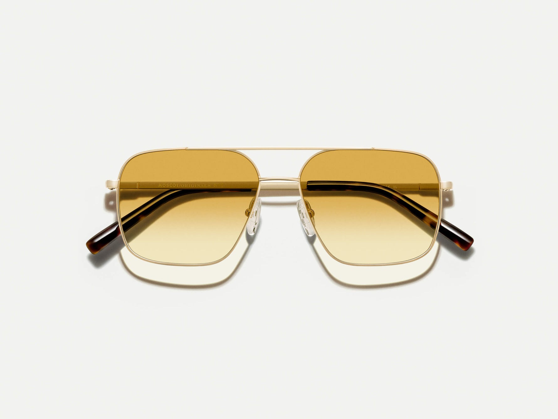 The SHTARKER in Gold with Chestnut Fade Tinted Lenses