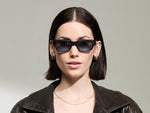 Model is wearing The SHTUP SUN in size 51 in Grey with Denim Blue Tinted Lenses