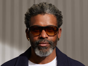 Model is wearing The SHVITZ SUN in Grey-Brown Fade in size 57 with Chestnut Fade Tinted Lenses