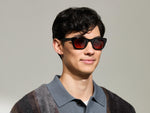 Model is wearing The SPILKES SUN in size 48 in Black with Cabernet Tinted Lenses