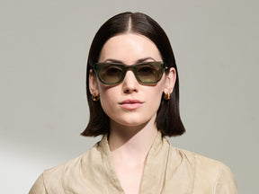 Model is wearing The SPILKES SUN in size 48 in Pine with Forest Wood Tinted Lenses 