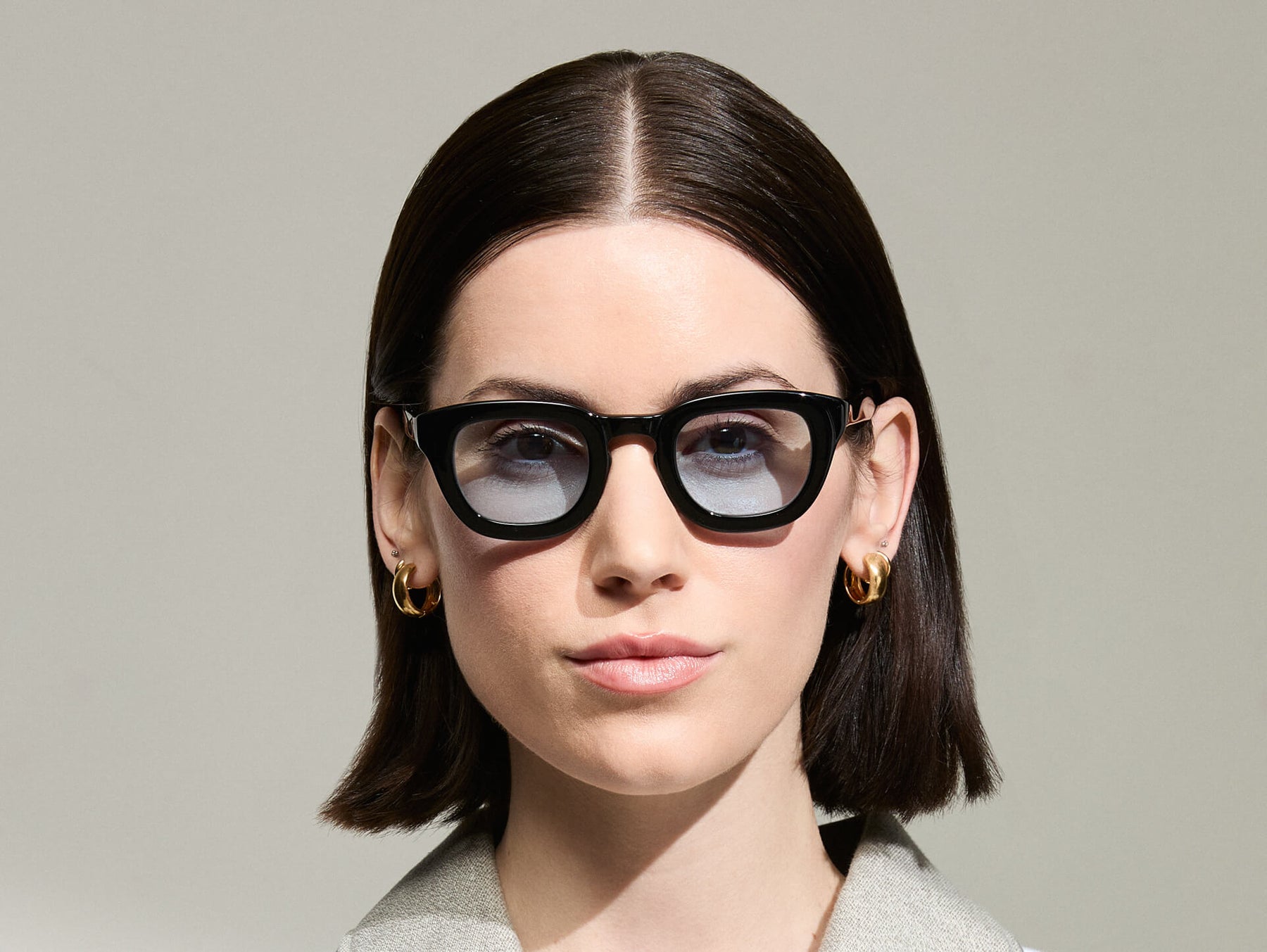 The Model is wearing The TELENA in Black in Size 44 with Bel Air Blue Tinted Lenses