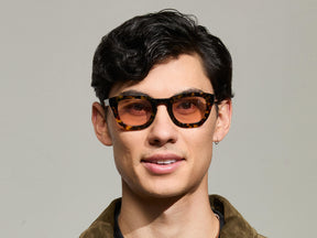 Model is wearing The TELENA  in Tortoise/Black in size 47 with New York Rose Tinted Lenses