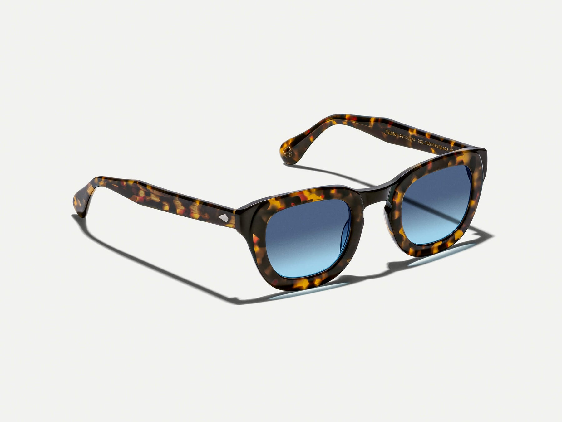 The TELENA in Tortoise/Black with Denim Blue Tinted Lenses