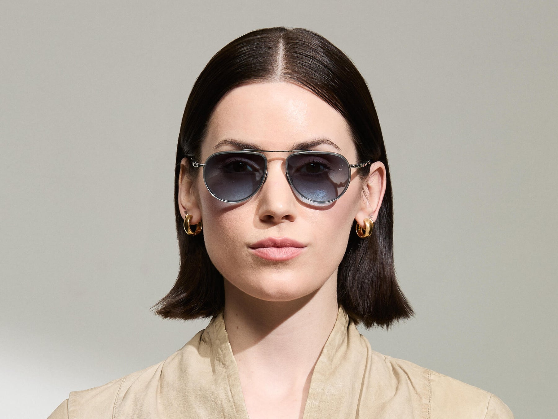 Model is wearing The TRAIF SUN in size 52 in Light Blue with Denim Blue Tinted Lenses