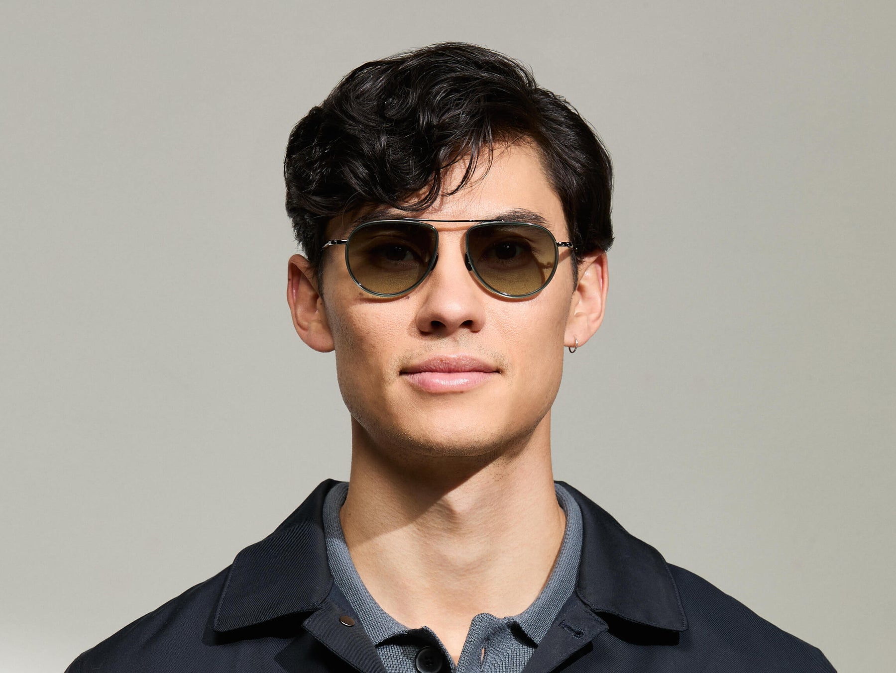 Model is wearing The TRAIF SUN in size 52 in Pine with Forest Wood Tinted Lenses