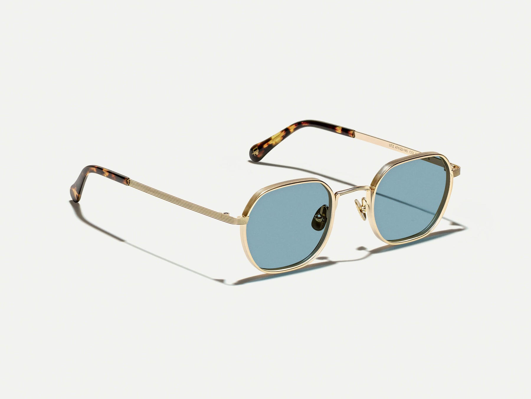 The UTZ SUN in Gold with Blue Tinted Lenses