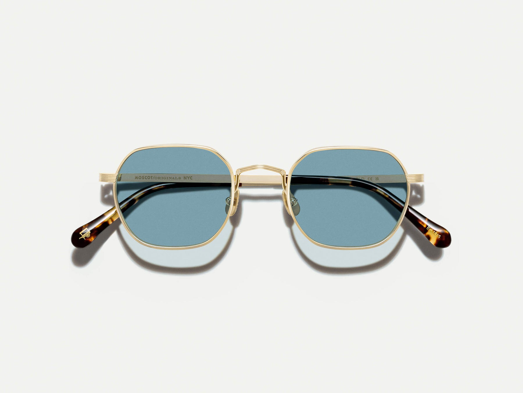 The UTZ SUN in Gold with Blue Tinted Lenses