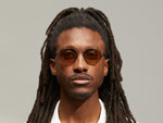 Model is wearing The UTZ SUN in size 50 in Navy with Amber Tinted Lenses