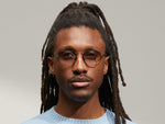 Model is wearing The UTZ SUN in size 50 in Pewter with American Grey Fade Tinted Lenses
