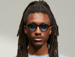 Model is wearing The VANTZ SUN in Black in size 50 with Broadway Blue Fade Tinted Lenses