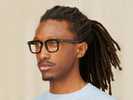 Model is wearing The ZISSEL in size 49 in Black