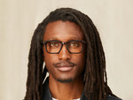 Model is wearing The ZISSEL in size 49 in Dark Brown/Tortoise