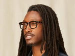 Model is wearing The ZISSEL in size 49 in Dark Brown/Tortoise