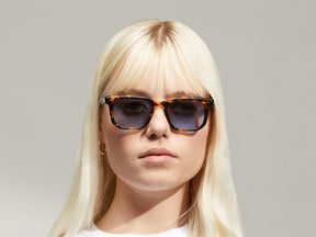 Model is wearing The ZISSEL SUN in size 49 in Classic Havana with Denim Blue Tinted Lenses