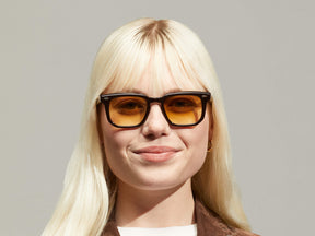 Model is wearing The ZISSEL SUN in size 49 in Dark Brown/Tortoise with Chestnut Fade Tinted Lenses