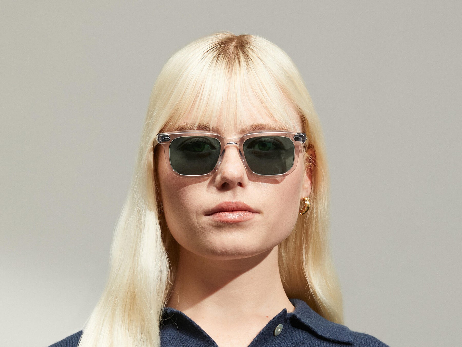 Model is wearing The ZISSEL SUN in size 49 in Light Grey with G-15 Tinted Lenses