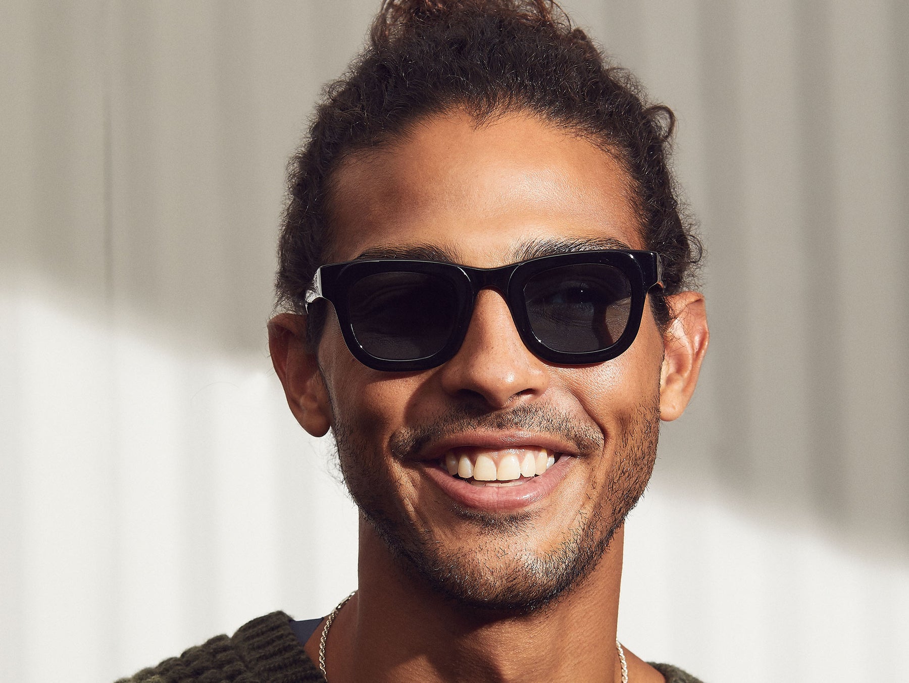 Model is wearing the FRITZ SUN in Black in size 44 with DG-37 Blue Glass Lenses