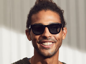 Model is wearing the FRITZ SUN in Black in size 44 with DG-37 Blue Glass Lenses