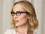 Model is wearing The LUCY READY READER in size 48 in Black/Horn