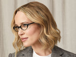 Model is wearing The MARILYN READY READER in size 48 in Cobblestone