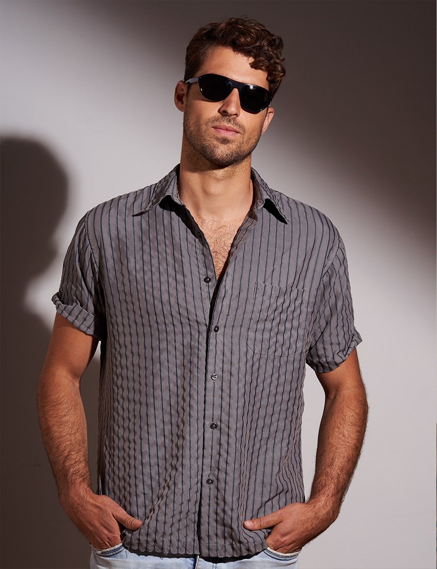 Model is wearing The AVRAM SUN in black in size 54 with G-15 Glass Lenses