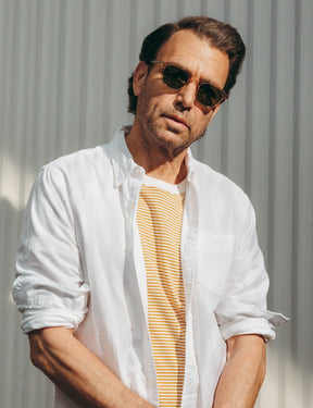 Model is wearing The BILLIK SUN in Cinnamon in size 47 with Calibar Green Glass Lenses