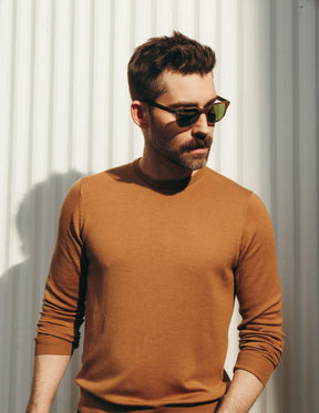 Model is wearing The BOYCHIK SUN in Matte Dark Blonde in size 52 with Calibar Green Glass Lenses