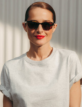 Model is wearing The BREN SUN in Classic Havana in size 51 with Cosmitan Brown Glass Lenses