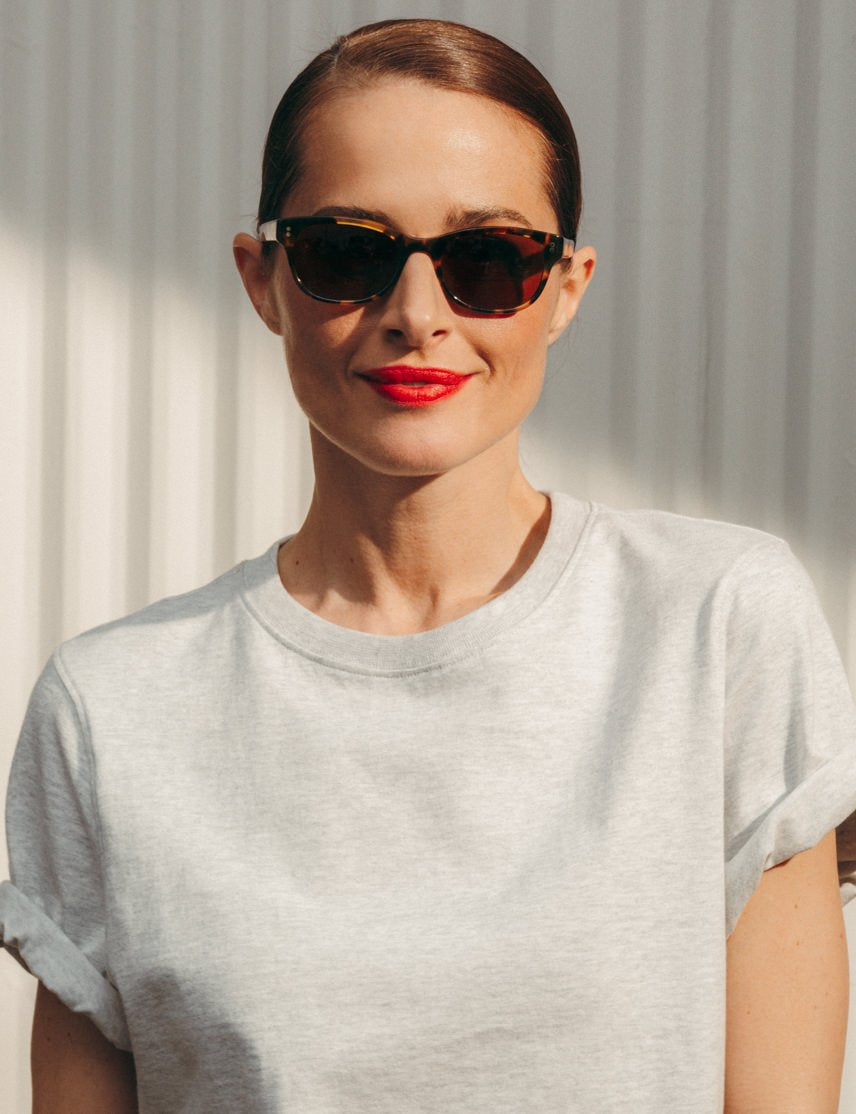 Model is wearing The BREN SUN in Classic Havana in size 51 with Cosmitan Brown Glass Lenses