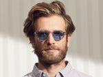Model is wearing The CLIPTOSH in Gold in size 46 with Celebrity Blue Tinted Lenses