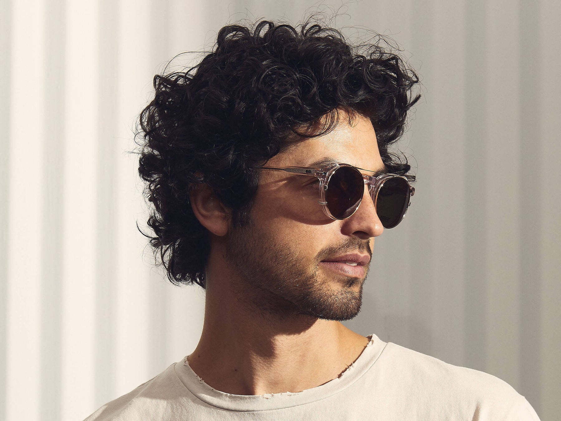 Model is wearing The CLIPZEN in Gold in size 49 with G-15 Lenses