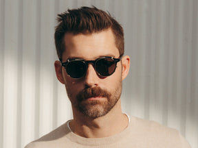 Model is wearing The CLIPZEN in Gold in size 49 with G-15 Lenses