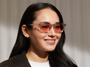 Model is wearing The DAVHEN in Mist in size 47 with New York Rose Tinted Lenses