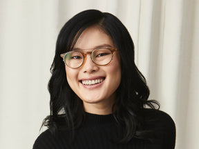 Model is wearing The FRANKIE CLIP in Brass in size 51 with Blue Protect Lenses