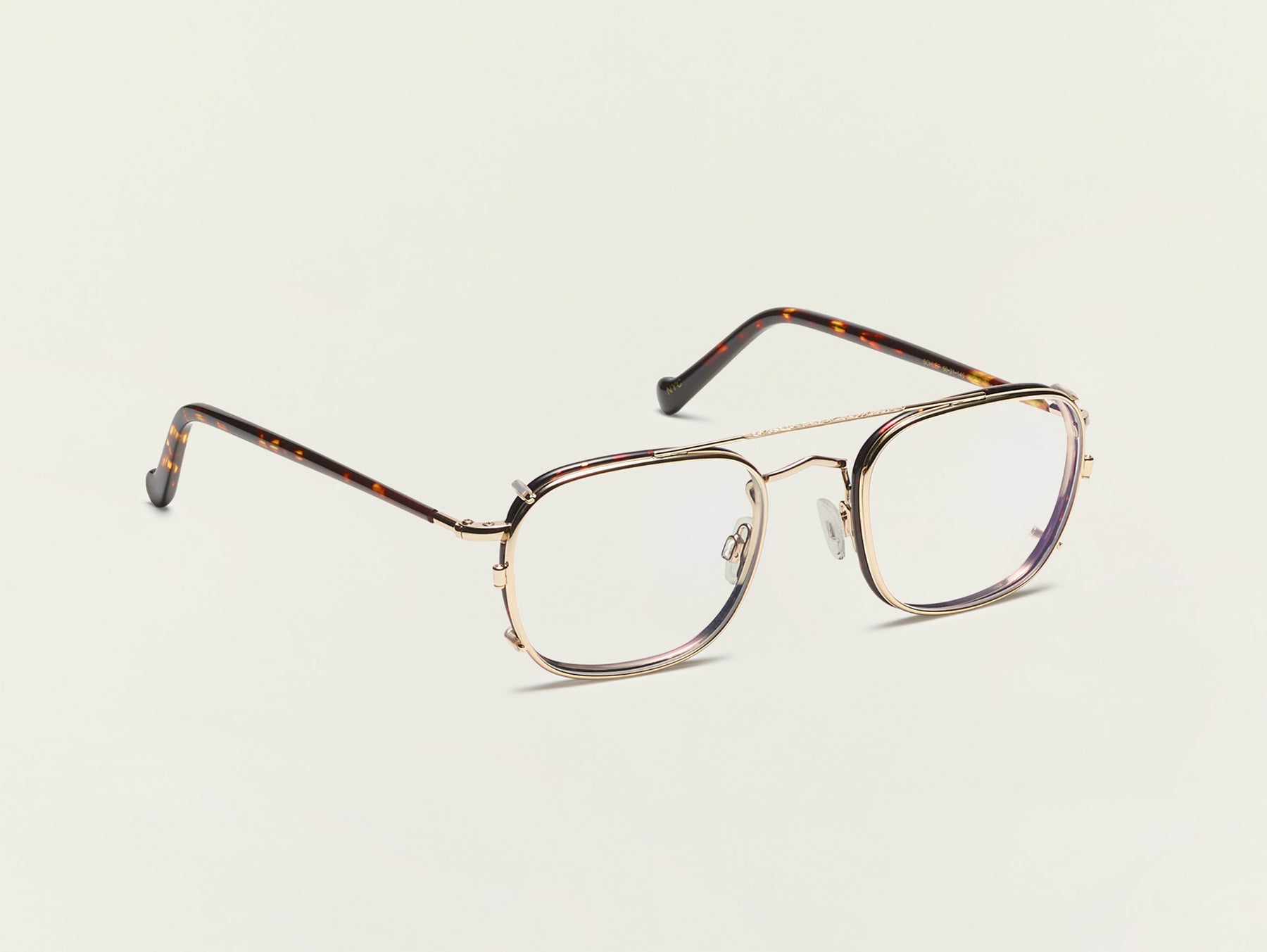 The SCHLEP CLIP in Gold with Blue Protect Lenses