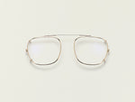 The SCHLEP CLIP in Gold with Blue Protect Lenses