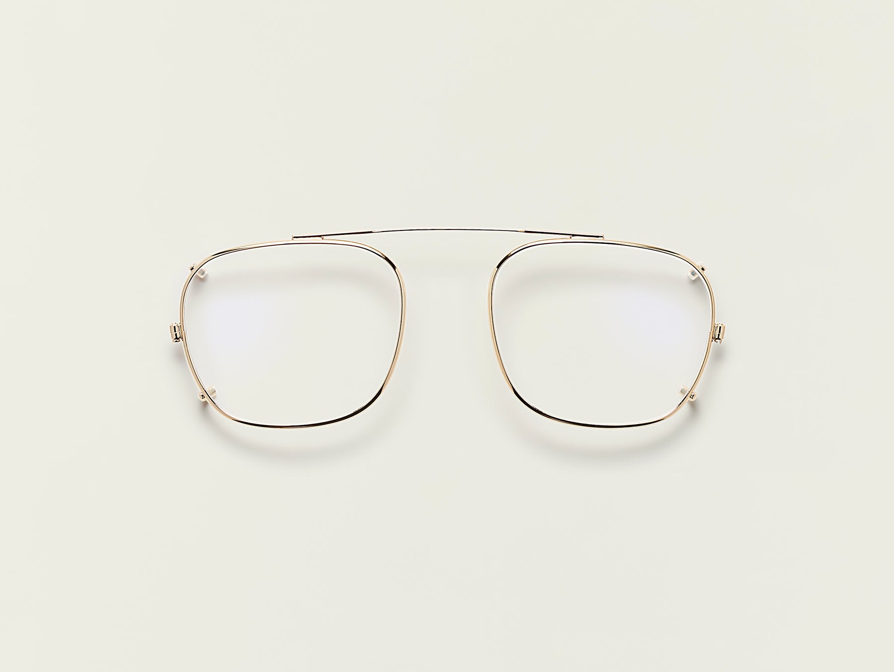 The SCHLEP CLIP in Gold with Blue Protect Lenses