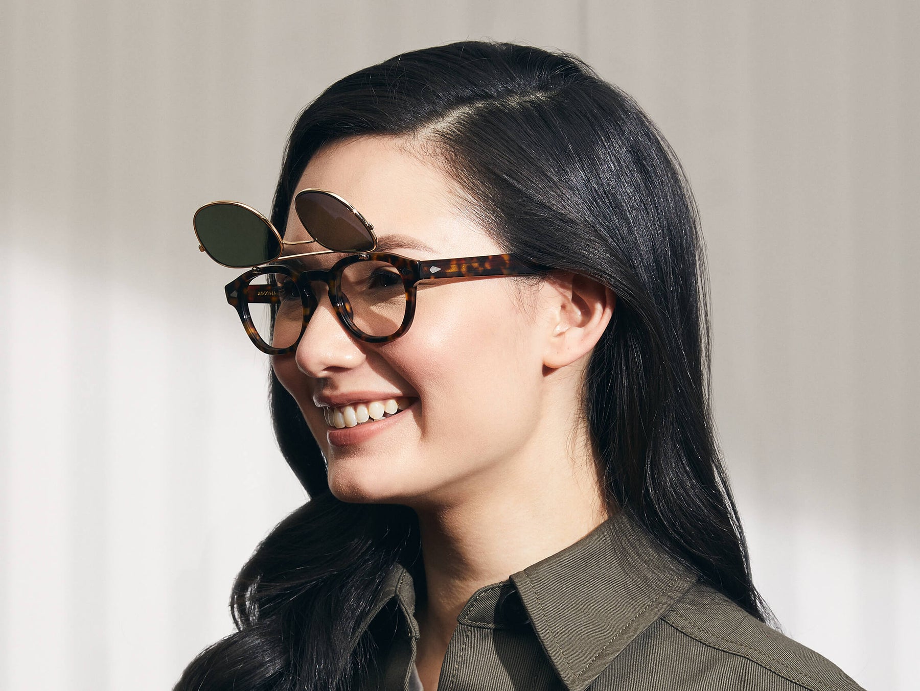 Model is wearing The FLIPTOSH in Tortoise in size 49 with G-15 Flip Lenses