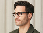 Model is wearing The GELT in size 49 in Tortoise